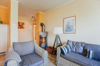Ein Sitzbereich in der Unterkunft Ferienwohnung Am Leuchtfeuer EG