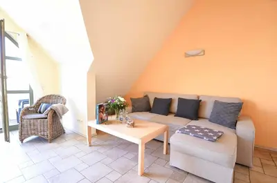 Ein Sitzbereich in der Unterkunft Ferienwohnung Am Leuchtfeuer OG LF 7 2