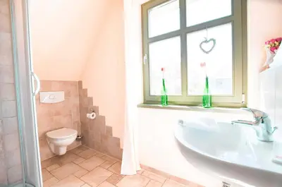 Ein Badezimmer in der Unterkunft Ferienwohnung Am Leuchtfeuer OG LF 7 2