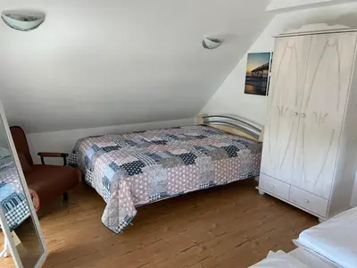 Ein Bett oder Betten in einem Zimmer der Unterkunft WITHA