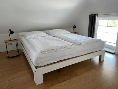 Ein Bett oder Betten in einem Zimmer der Unterkunft WITHA