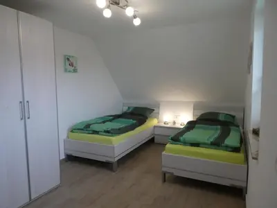 Ein Bett oder Betten in einem Zimmer der Unterkunft Kleine Seenixe