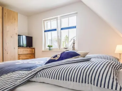 Ein Bett oder Betten in einem Zimmer der Unterkunft Rosenbergsiedlung 13 A 