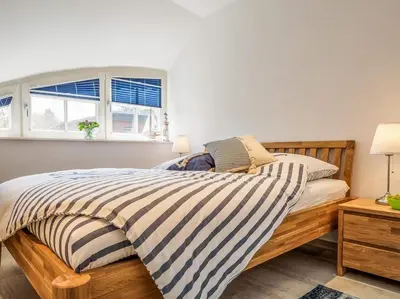 Ein Bett oder Betten in einem Zimmer der Unterkunft Rosenbergsiedlung 13 A 
