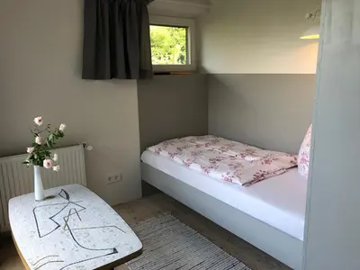 Ein Bett oder Betten in einem Zimmer der Unterkunft Gartenhaus