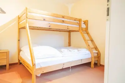 Ein Bett oder Betten in einem Zimmer der Unterkunft Hexenhaus Remise