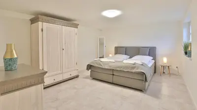Ein Bett oder Betten in einem Zimmer der Unterkunft Kapitänshaus Koje