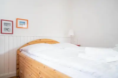 Ein Bett oder Betten in einem Zimmer der Unterkunft Haus Alte Bäckerei Sandbank