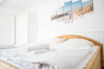 Ein Bett oder Betten in einem Zimmer der Unterkunft Haus Alte Bäckerei Sandbank