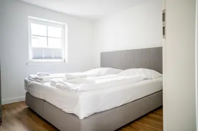 Ein Bett oder Betten in einem Zimmer der Unterkunft Kapitänshaus Kammer