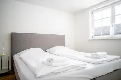 Ein Bett oder Betten in einem Zimmer der Unterkunft Kapitänshaus Kammer