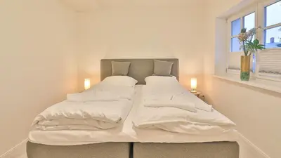 Ein Bett oder Betten in einem Zimmer der Unterkunft Kapitänshaus Kajüte