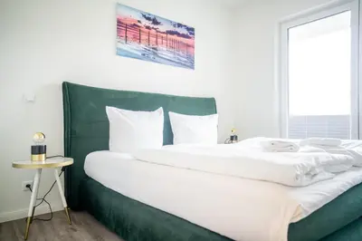 Ein Bett oder Betten in einem Zimmer der Unterkunft Apartmenthaus Wittsande Wittsande 09