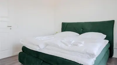 Ein Bett oder Betten in einem Zimmer der Unterkunft Apartmenthaus Wittsande Wittsande 11