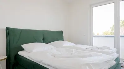 Ein Bett oder Betten in einem Zimmer der Unterkunft Apartmenthaus Wittsande Wittsande 11