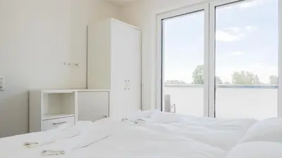 Ein Bett oder Betten in einem Zimmer der Unterkunft Apartmenthaus Wittsande Wittsande 13