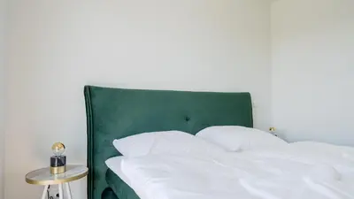Ein Bett oder Betten in einem Zimmer der Unterkunft Apartmenthaus Wittsande Wittsande 13