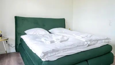 Ein Bett oder Betten in einem Zimmer der Unterkunft Apartmenthaus Wittsande Wittsande 14