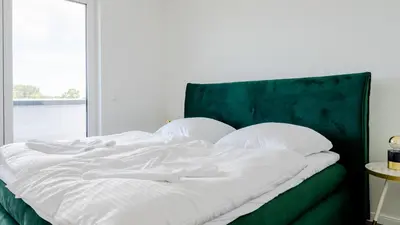Ein Bett oder Betten in einem Zimmer der Unterkunft Apartmenthaus Wittsande Wittsande 15