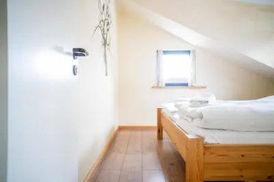 Ein Bett oder Betten in einem Zimmer der Unterkunft Hexenhaus Kammer