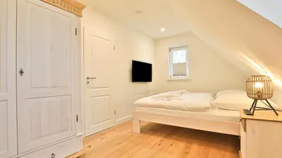 Ein Bett oder Betten in einem Zimmer der Unterkunft Traumgarten Haus Leidenschaft