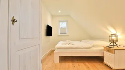 Ein Bett oder Betten in einem Zimmer der Unterkunft Traumgarten Haus Leidenschaft