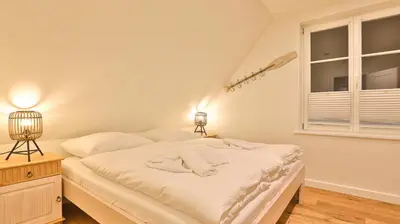 Ein Bett oder Betten in einem Zimmer der Unterkunft Traumgarten Villa Sanftmut