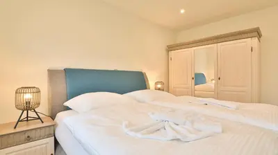 Ein Bett oder Betten in einem Zimmer der Unterkunft Strandhaus Zingst Apartment 09