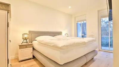 Ein Bett oder Betten in einem Zimmer der Unterkunft Strandhaus Zingst Apartment 10