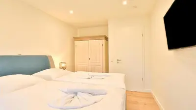 Ein Bett oder Betten in einem Zimmer der Unterkunft Strandhaus Zingst Apartment 10