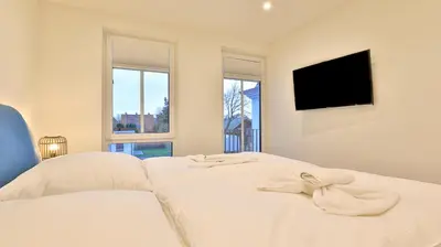Ein Bett oder Betten in einem Zimmer der Unterkunft Strandhaus Zingst Apartment 12