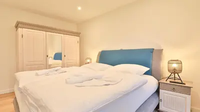 Ein Bett oder Betten in einem Zimmer der Unterkunft Strandhaus Zingst Apartment 12