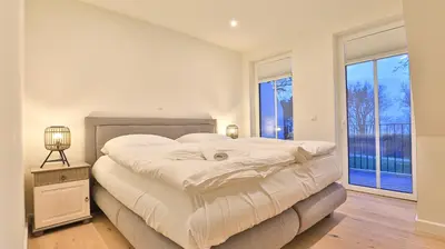 Ein Bett oder Betten in einem Zimmer der Unterkunft Strandhaus Zingst Apartment 14
