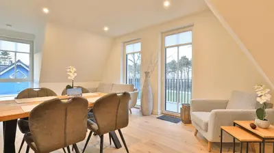 Ein Sitzbereich in der Unterkunft Strandhaus Zingst Apartment 15