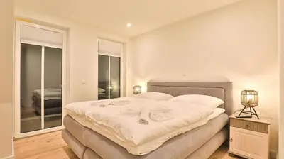 Ein Bett oder Betten in einem Zimmer der Unterkunft Strandhaus Zingst Apartment 15