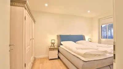 Ein Bett oder Betten in einem Zimmer der Unterkunft Strandhaus Zingst Apartment 08