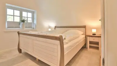 Ein Bett oder Betten in einem Zimmer der Unterkunft Kapitänshaus Brücke