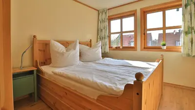 Ein Bett oder Betten in einem Zimmer der Unterkunft Heideröschen Park Heideröschen 5
