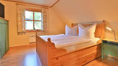 Ein Bett oder Betten in einem Zimmer der Unterkunft Heideröschen Park Heideröschen 9
