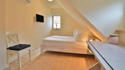 Ein Bett oder Betten in einem Zimmer der Unterkunft Heideröschen Park Heideröschen 5d