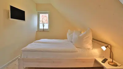Ein Bett oder Betten in einem Zimmer der Unterkunft Heideröschen Park Heideröschen 5d