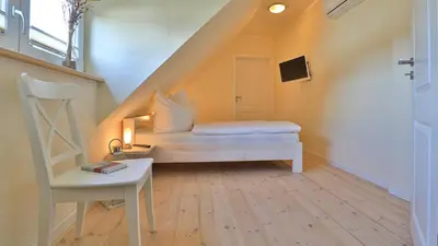 Ein Bett oder Betten in einem Zimmer der Unterkunft Heideröschen Park Heideröschen 9c