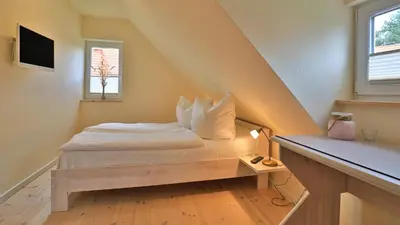 Ein Bett oder Betten in einem Zimmer der Unterkunft Heideröschen Park Heideröschen 9c