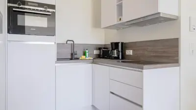 Küche/Küchenzeile in der Unterkunft Apartmenthaus Wittsande Wittsande 02