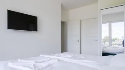 Ein Bett oder Betten in einem Zimmer der Unterkunft Apartmenthaus Wittsande Wittsande 04