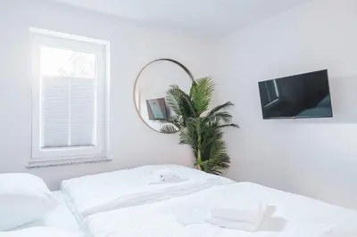 Ein Bett oder Betten in einem Zimmer der Unterkunft Dünenquartier Apartment 02
