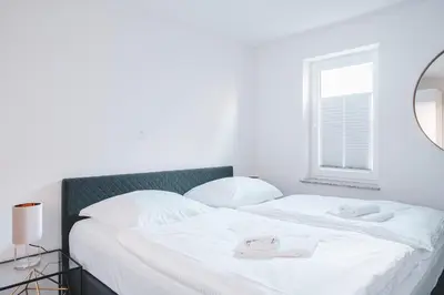 Ein Bett oder Betten in einem Zimmer der Unterkunft Dünenquartier Apartment 02
