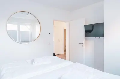 Ein Bett oder Betten in einem Zimmer der Unterkunft Dünenquartier Apartment 02