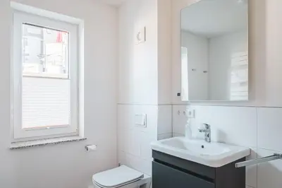 Ein Badezimmer in der Unterkunft Dünenquartier Apartment 02