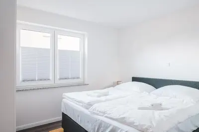 Ein Bett oder Betten in einem Zimmer der Unterkunft Dünenquartier Apartment 02